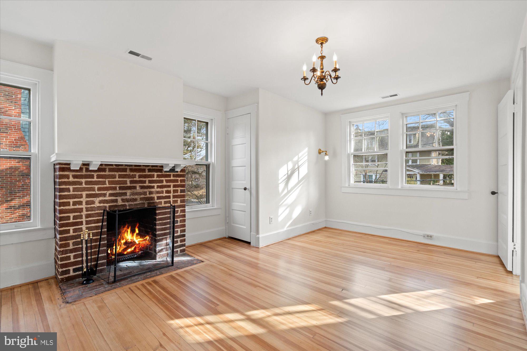 3803 Taylor Street Chevy Chase, MD 20815 - Photo 22 of 35 a living room with furniture and a fireplace