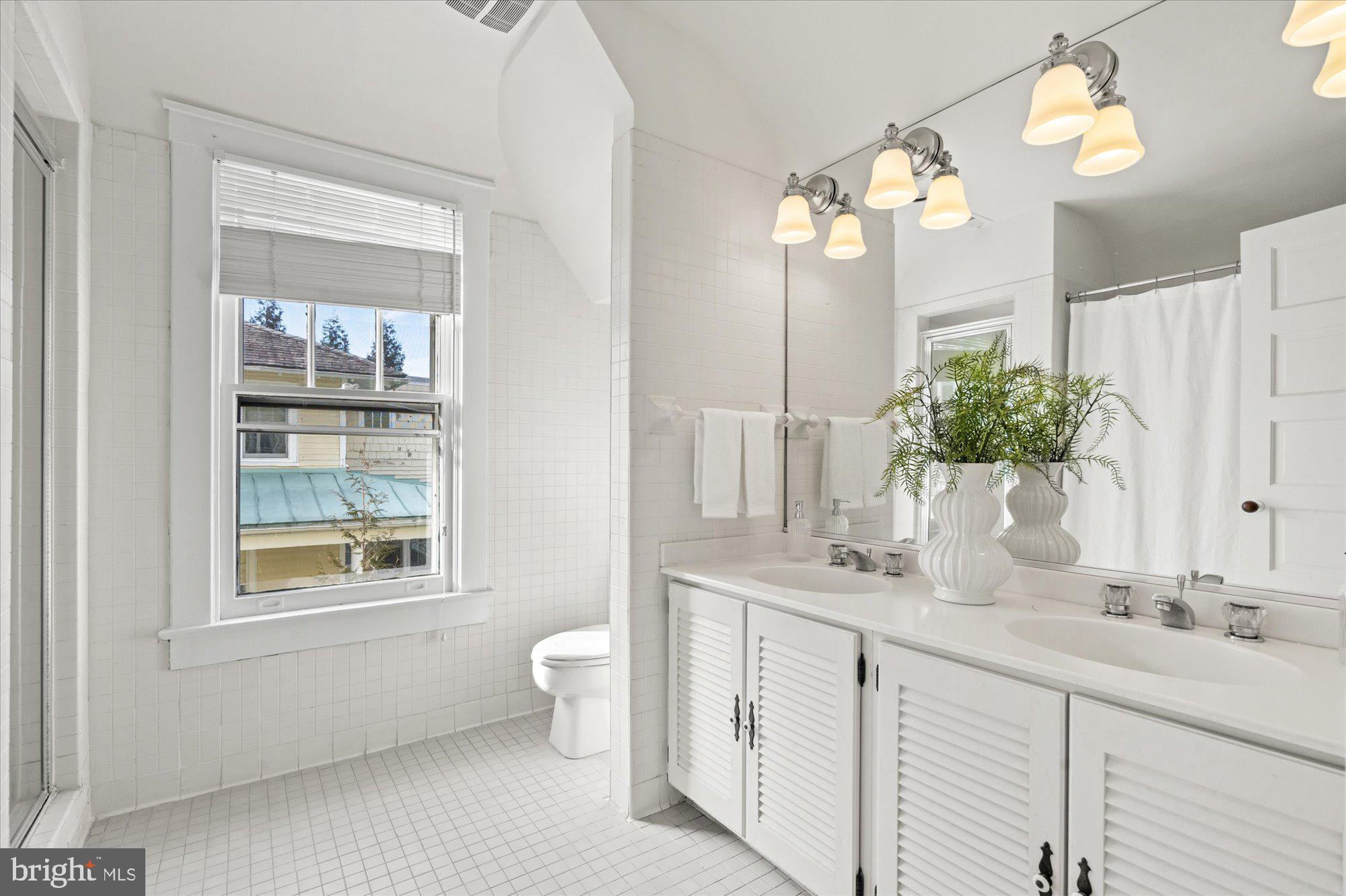 3803 Taylor Street Chevy Chase, MD 20815 - Photo 24 of 35 Hall bathroom with separate tub and shower