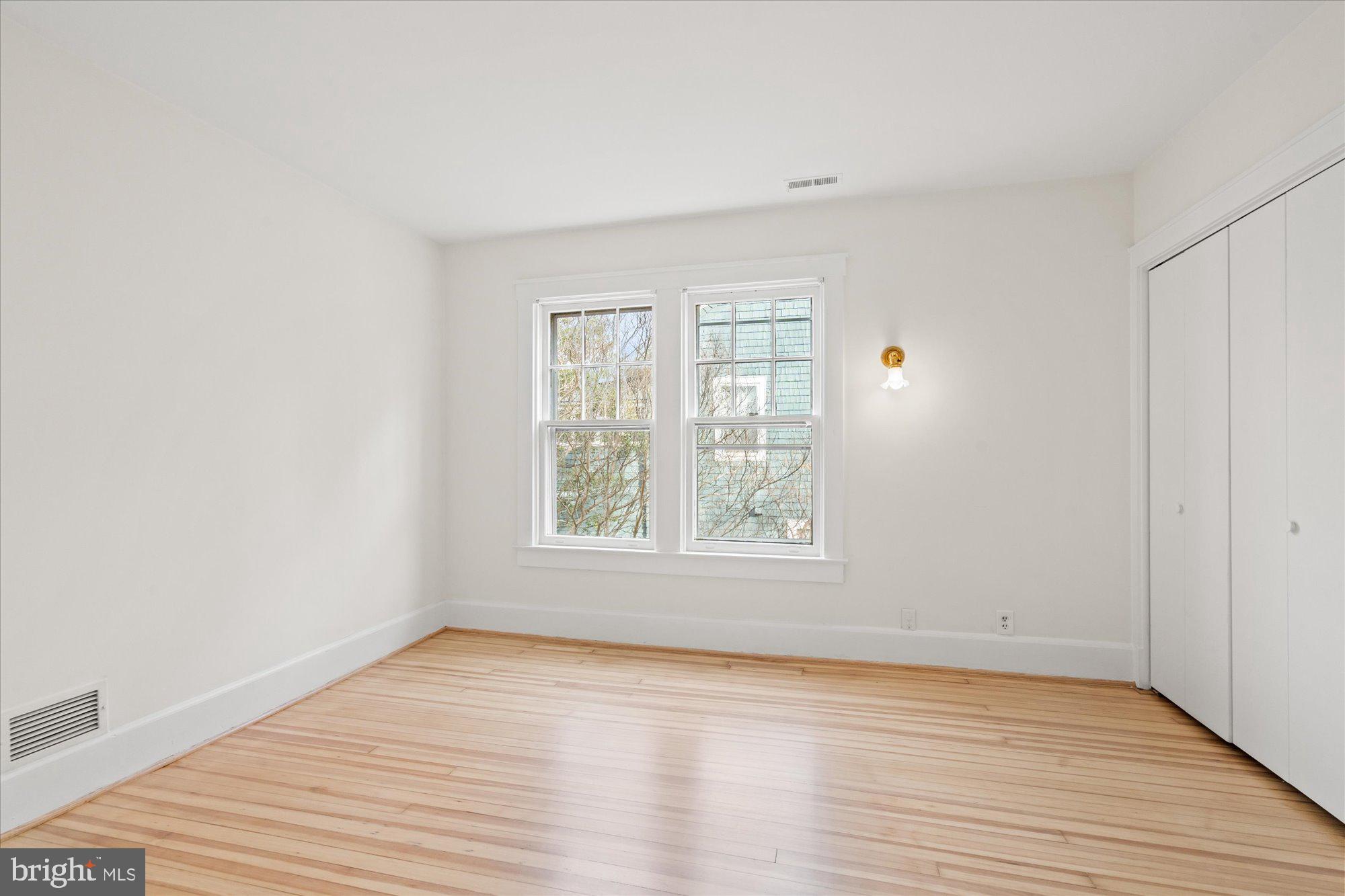 3803 Taylor Street Chevy Chase, MD 20815 - Photo 25 of 35 an empty room with wooden floor and windows