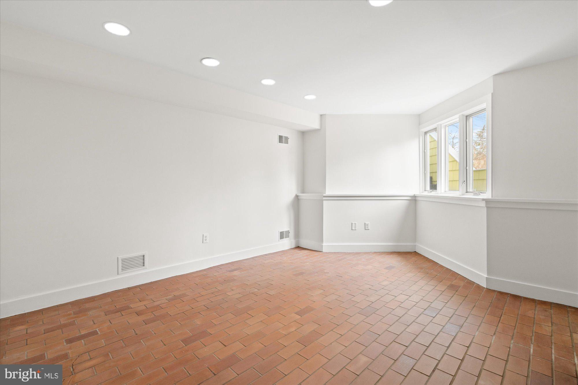 3803 Taylor Street Chevy Chase, MD 20815 - Photo 29 of 35 an empty room with a empty space and windows