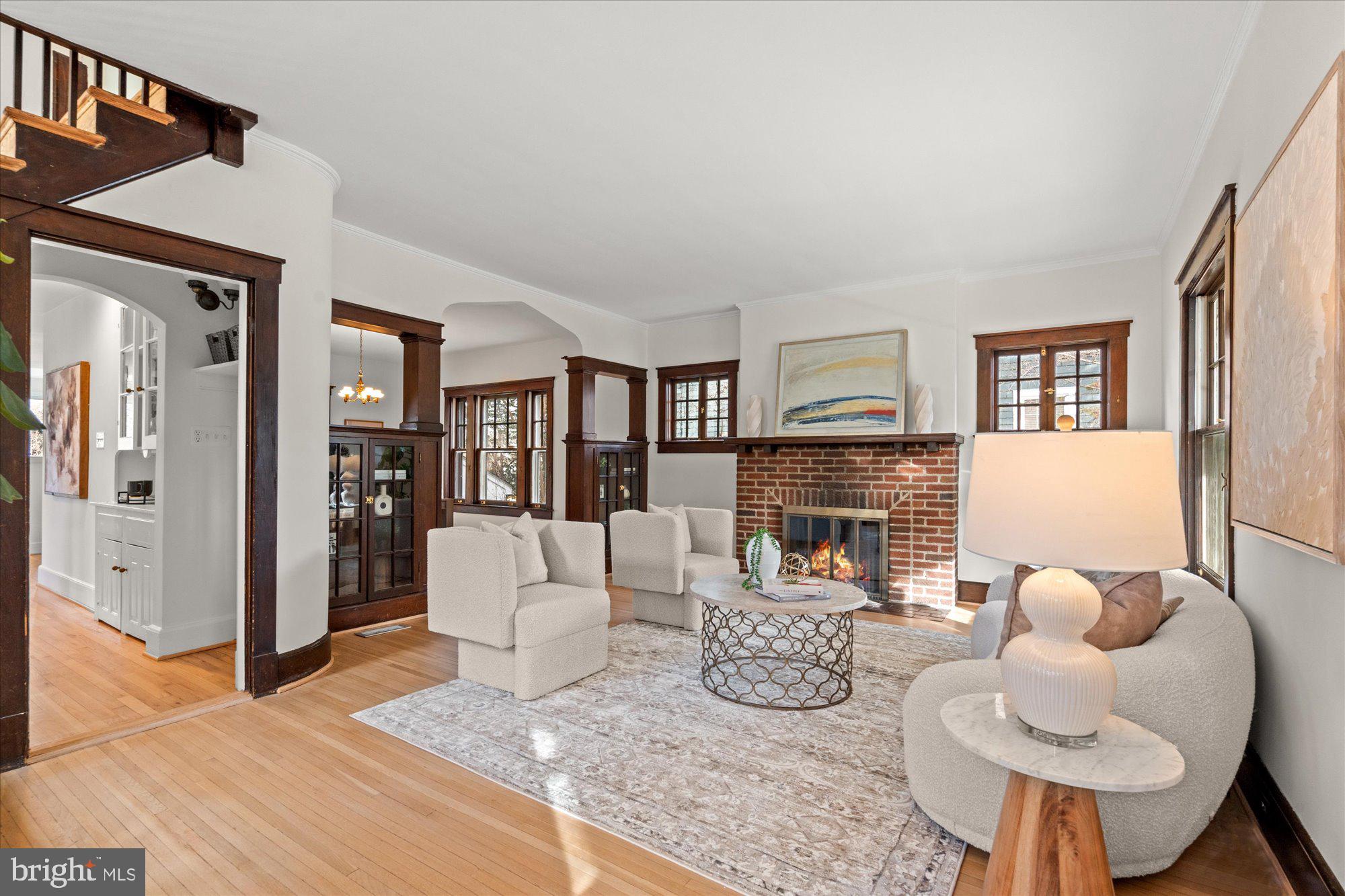 3803 Taylor Street Chevy Chase, MD 20815 - Photo 4 of 35 a living room with furniture and a fireplace