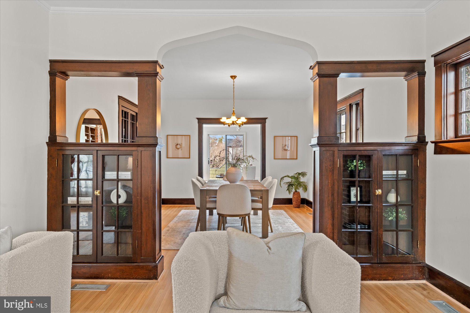 3803 Taylor Street Chevy Chase, MD 20815 - Photo 5 of 35 a living room with furniture a window and bookshelf