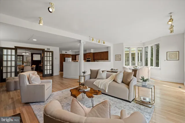 a view of a dining room with furniture and a book shelf
