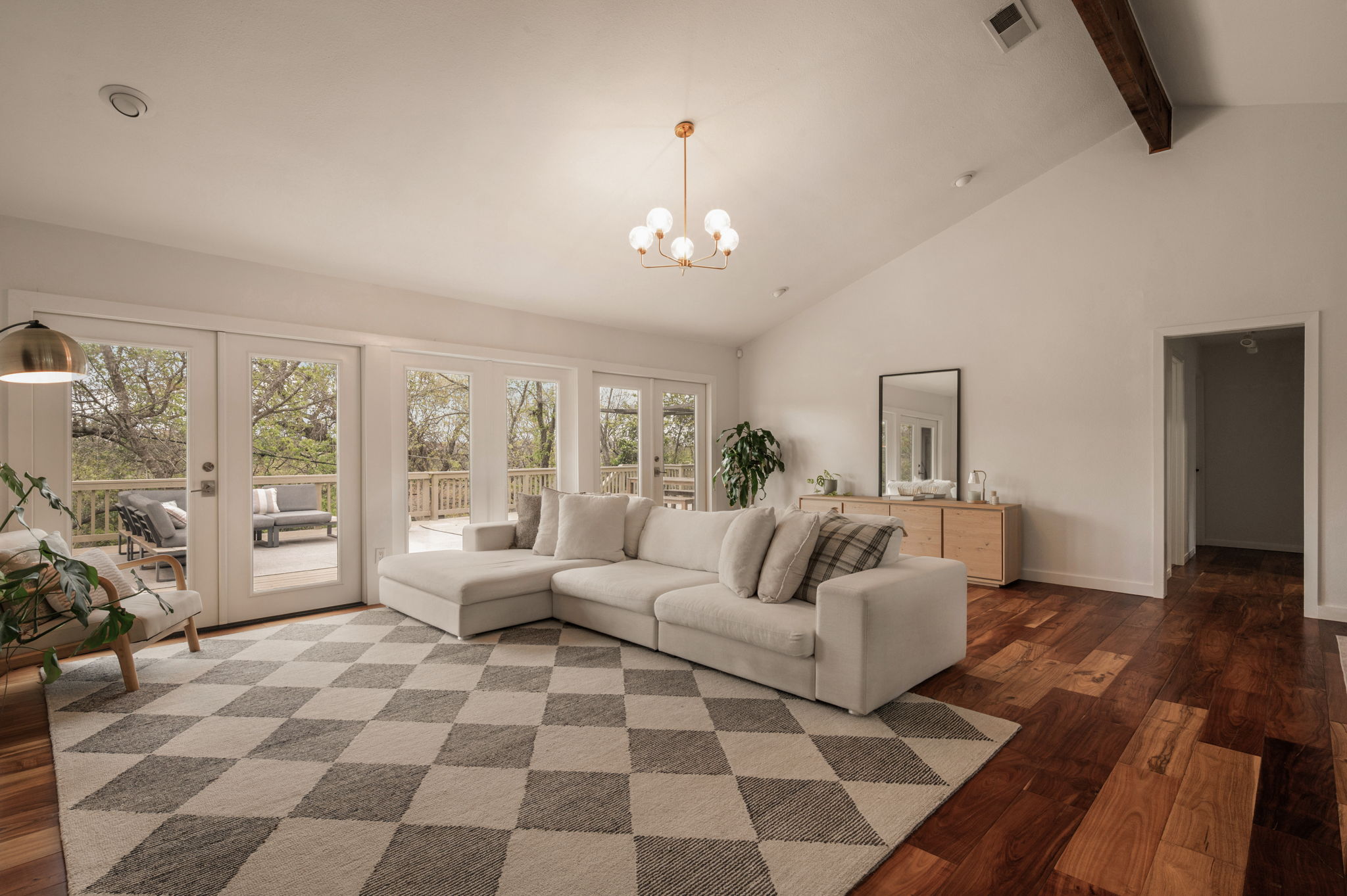 6501 Sumac Drive Austin, TX 78731 - Photo 6 of 40 Living room featuring french doors, dark wood-style floors, and suspended lighting