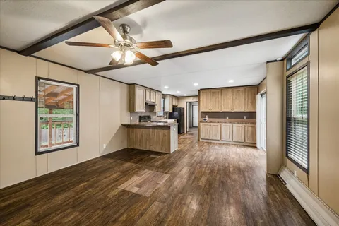 a view of kitchen with cabinets and wooden floor