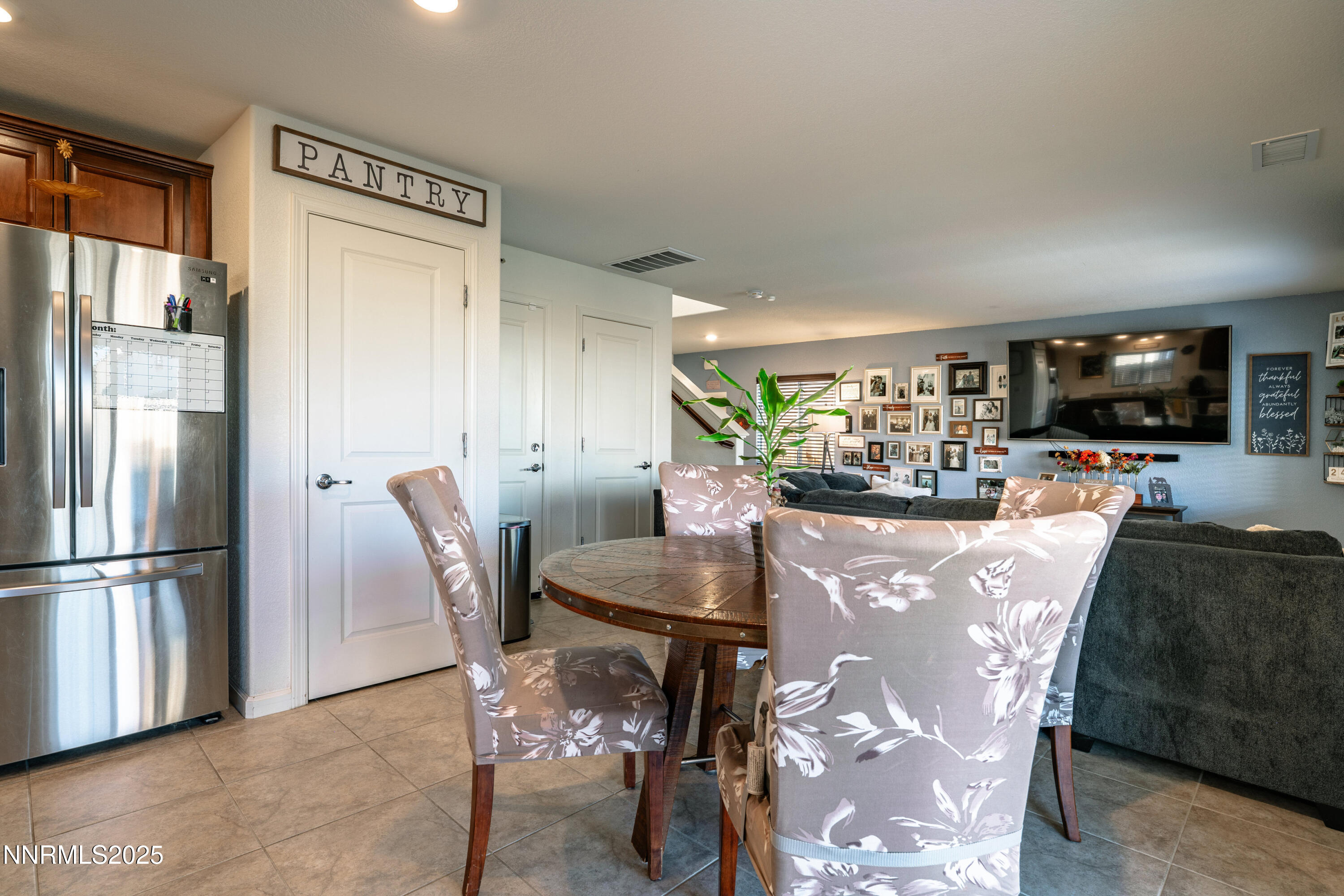 909 Convair Way Reno, NV 89506 - Photo 14 of 42 a dining room with furniture a window and kitchen view