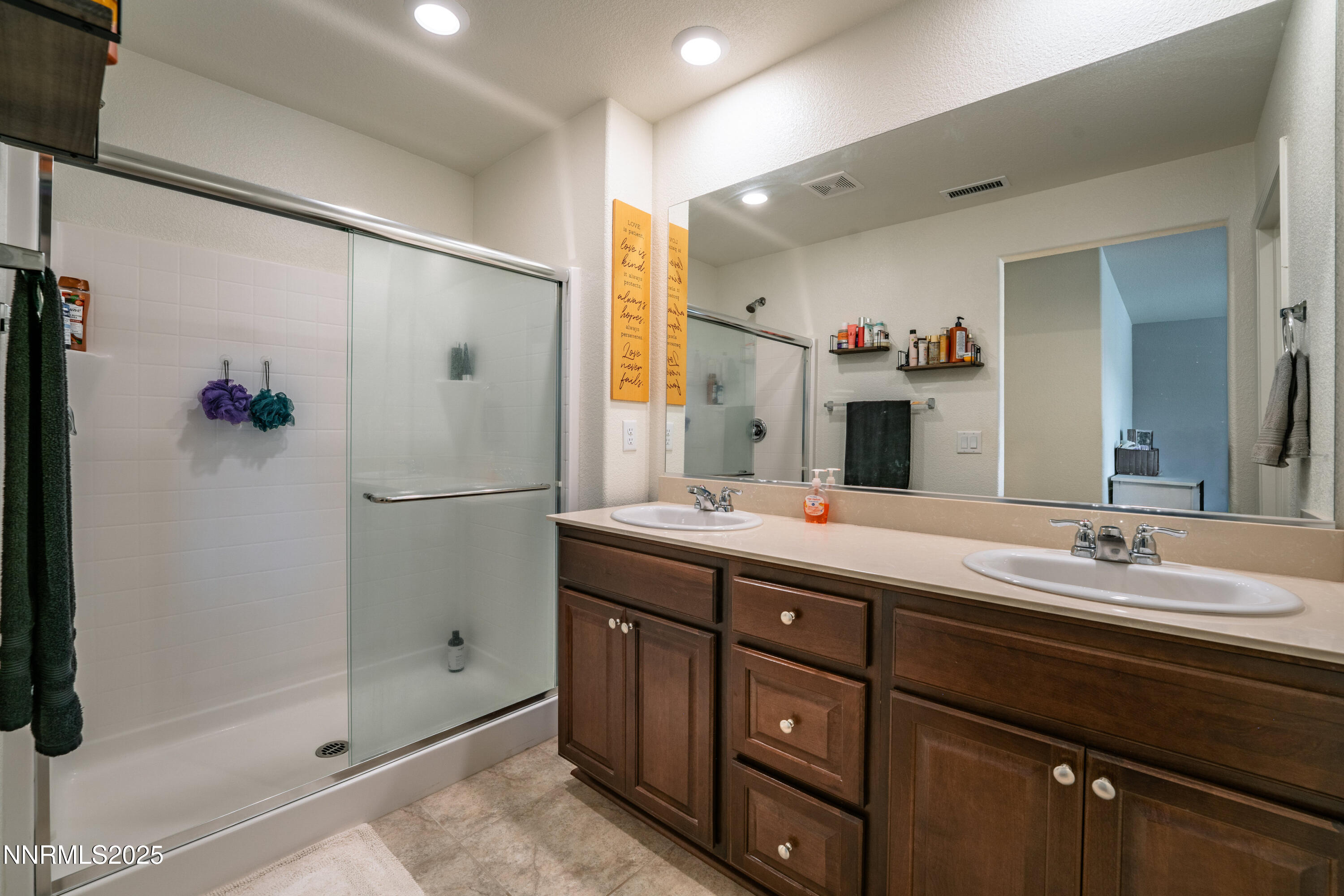 909 Convair Way Reno, NV 89506 - Photo 20 of 42 a bathroom with a double vanity sink mirror and double