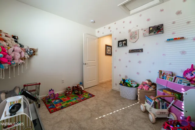 a view of a big house with a big yard and a large tree