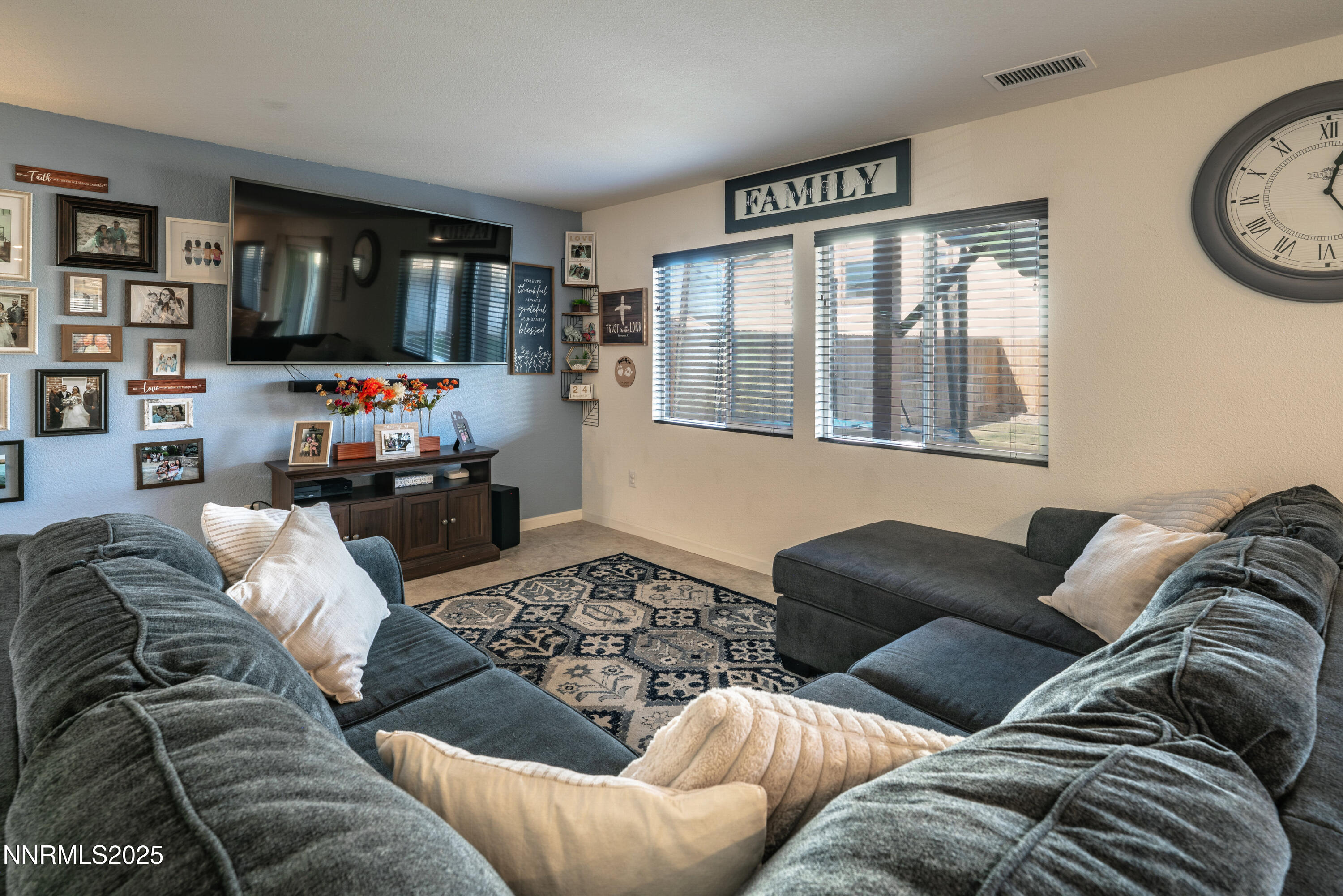 909 Convair Way Reno, NV 89506 - Photo 7 of 42 a living room with furniture ceiling fan and a window