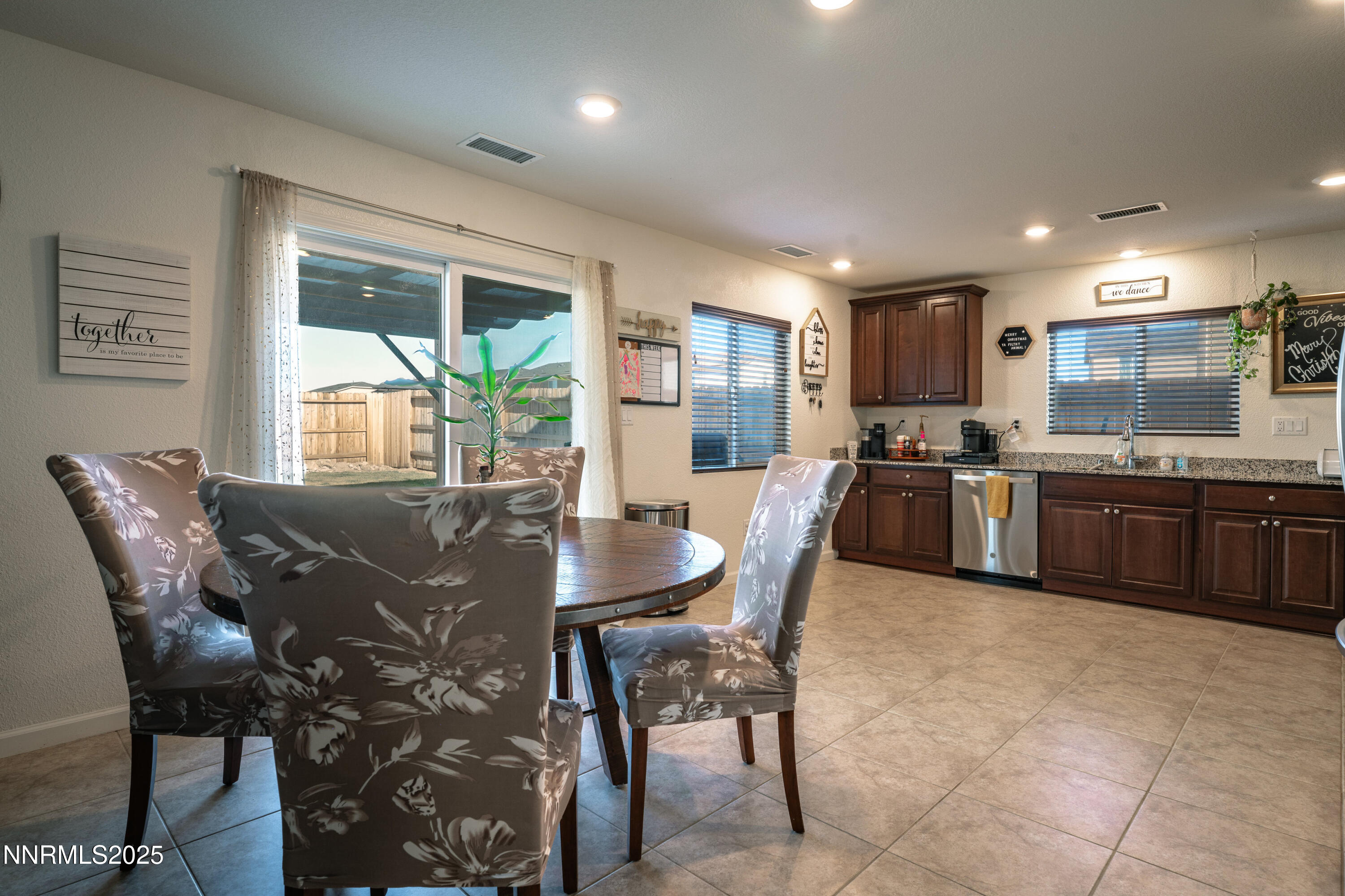 909 Convair Way Reno, NV 89506 - Photo 9 of 42 a view of a dining room with furniture window and outside view