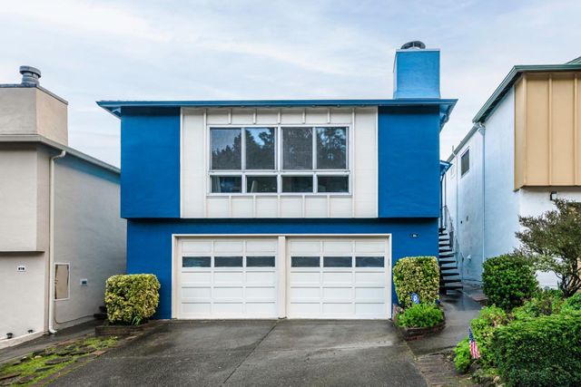 a house view with a backyard space