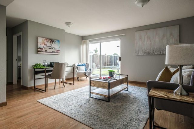 a living room with furniture and a window