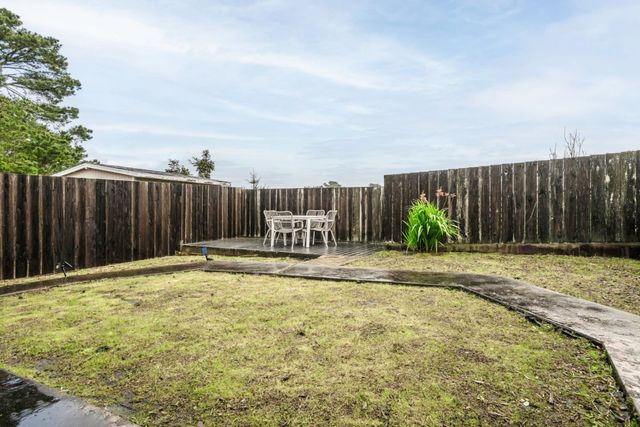 a swimming pool with wooden fence