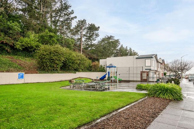 a view of a backyard with sitting area