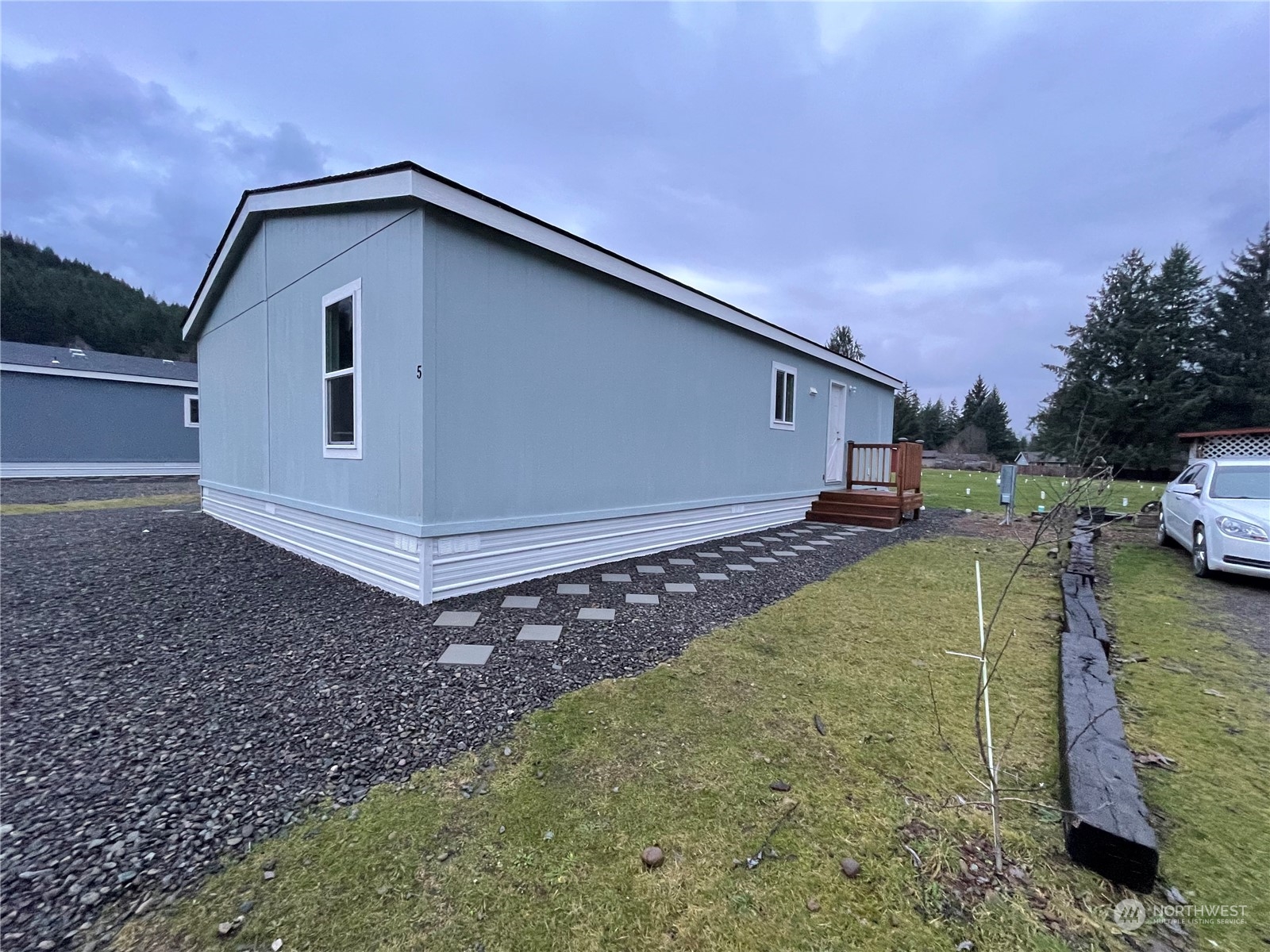2610 Calawah Way, Unit 5 Forks, WA 98331 - Photo 2 of 12 a front view of a house with a yard
