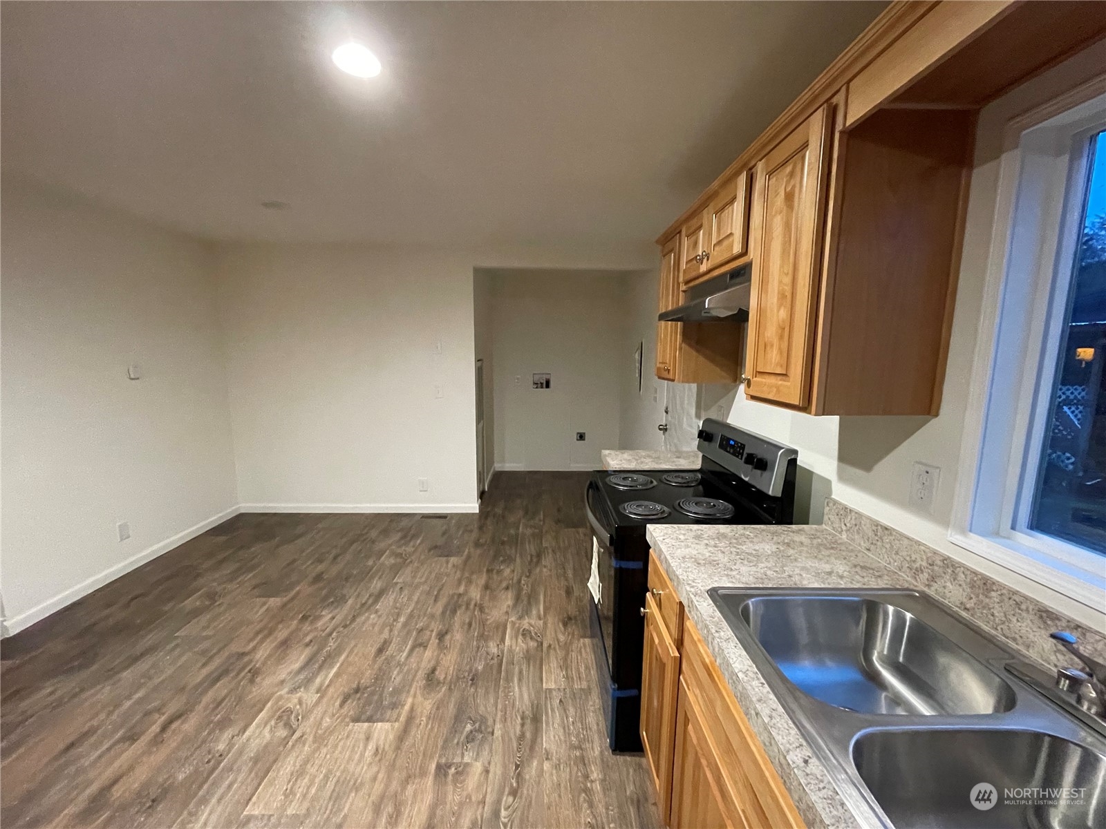 2610 Calawah Way, Unit 5 Forks, WA 98331 - Photo 5 of 12 a kitchen with a stove and a sink