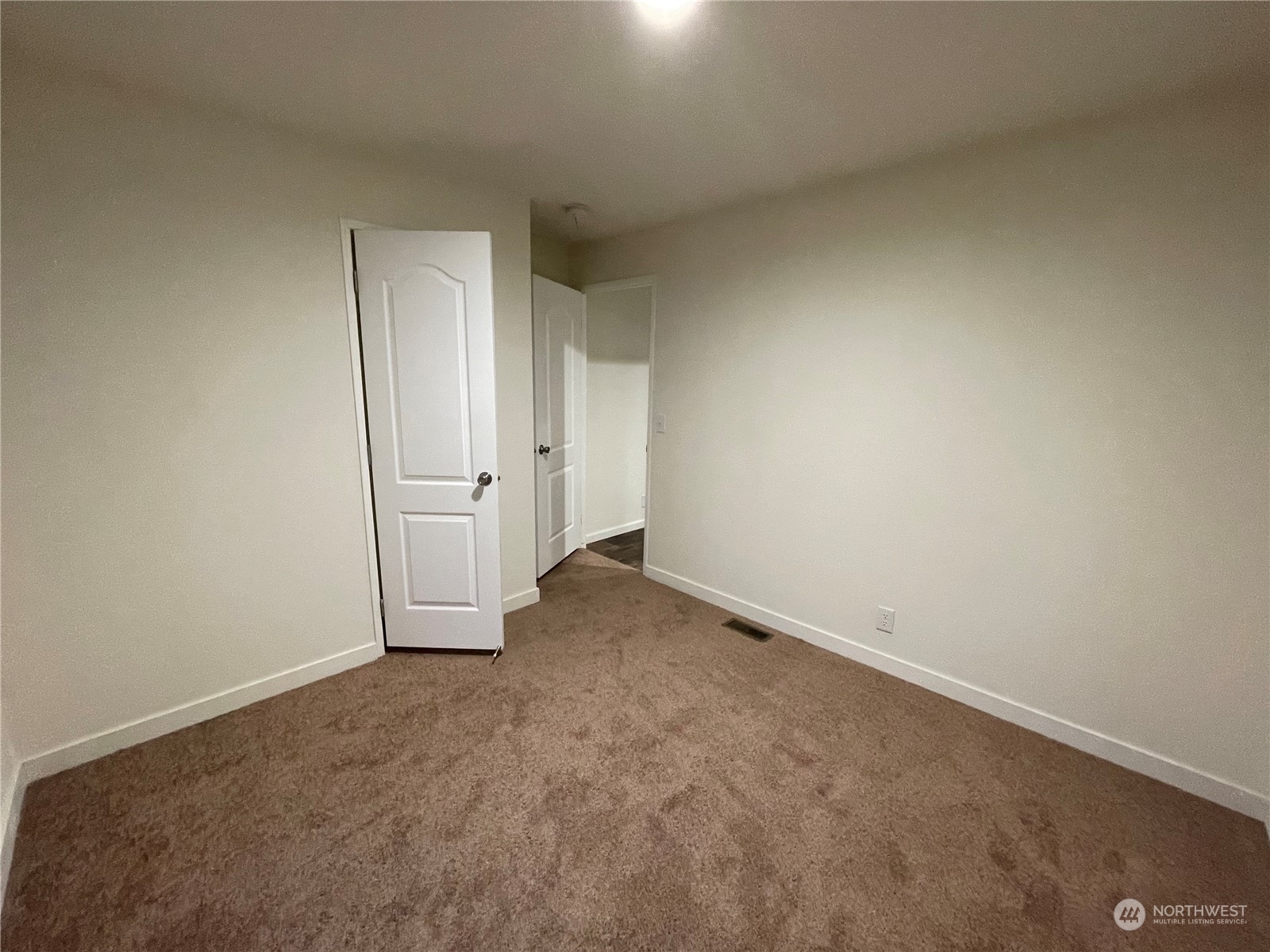 2610 Calawah Way, Unit 5 Forks, WA 98331 - Photo 10 of 12 an empty room with an entryway