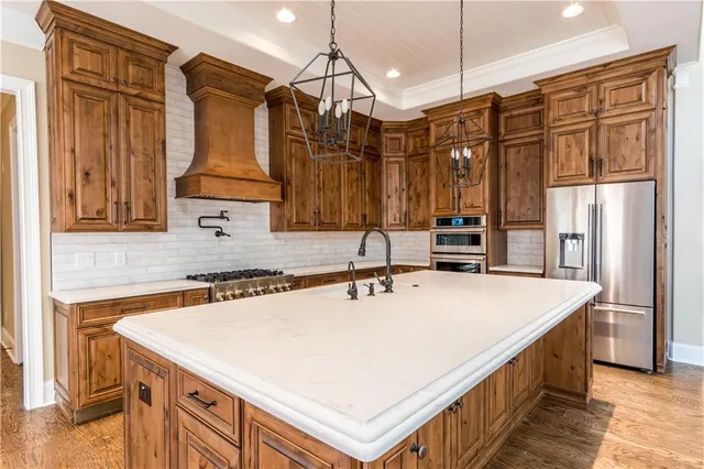a kitchen with a sink and cabinets