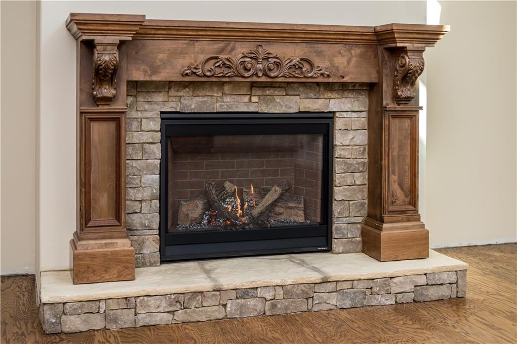 Lot 1 Cox Road Roswell, GA 30075 - Photo 13 of 36 a fireplace with a vase on top of it