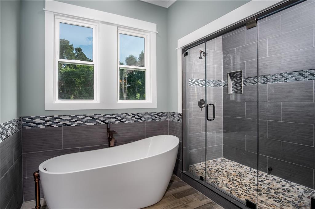 Lot 1 Cox Road Roswell, GA 30075 - Photo 27 of 36 a bathroom with a bathtub and shower