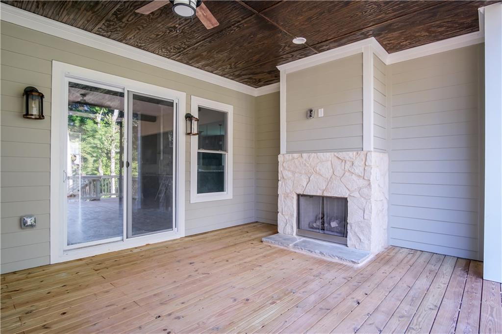 Lot 1 Cox Road Roswell, GA 30075 - Photo 28 of 36 a view of empty room with wooden floor and fireplace