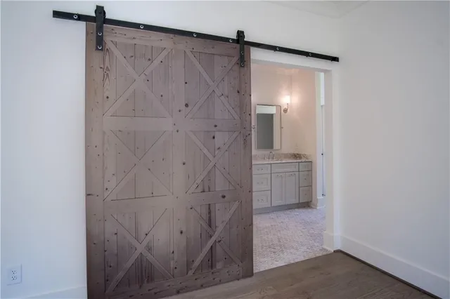 a kitchen with stainless steel appliances granite countertop a sink a stove and a refrigerator