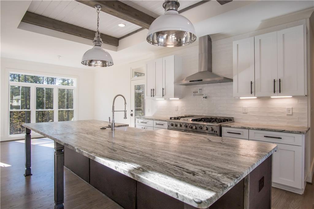 Lot 1 Cox Road Roswell, GA 30075 - Photo 30 of 36 a kitchen with stainless steel appliances granite countertop a sink a stove and a refrigerator