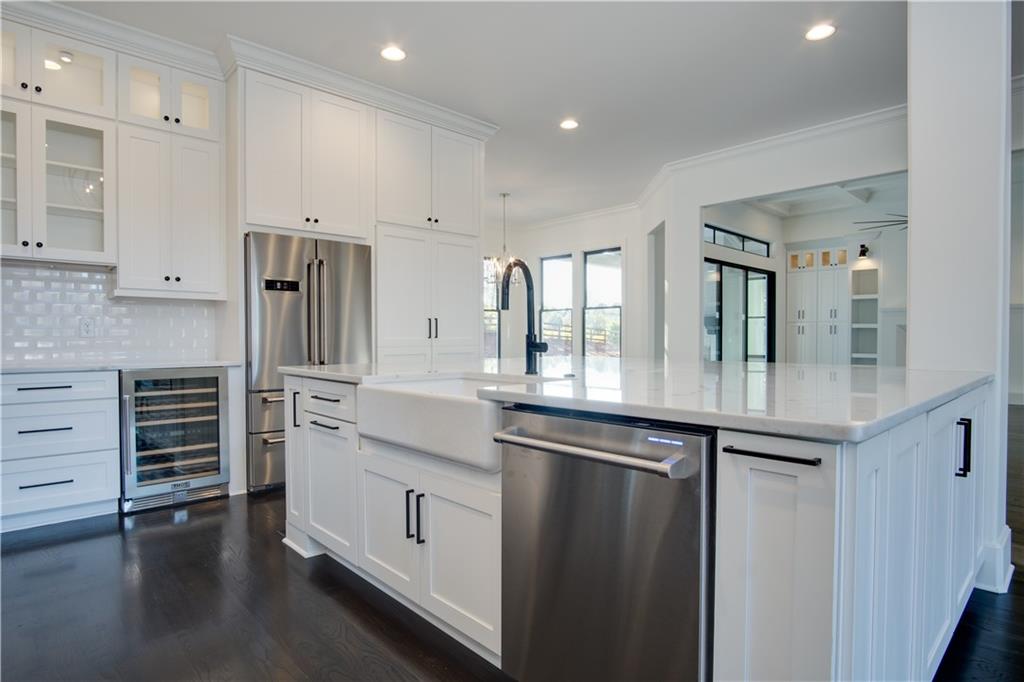 Lot 1 Cox Road Roswell, GA 30075 - Photo 5 of 36 a kitchen with stainless steel appliances a sink and cabinets