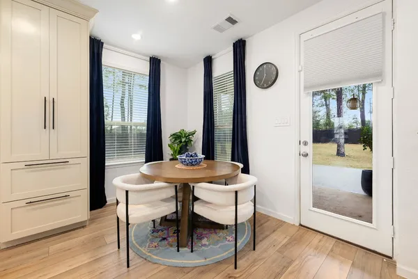 a view of a room with furniture and window