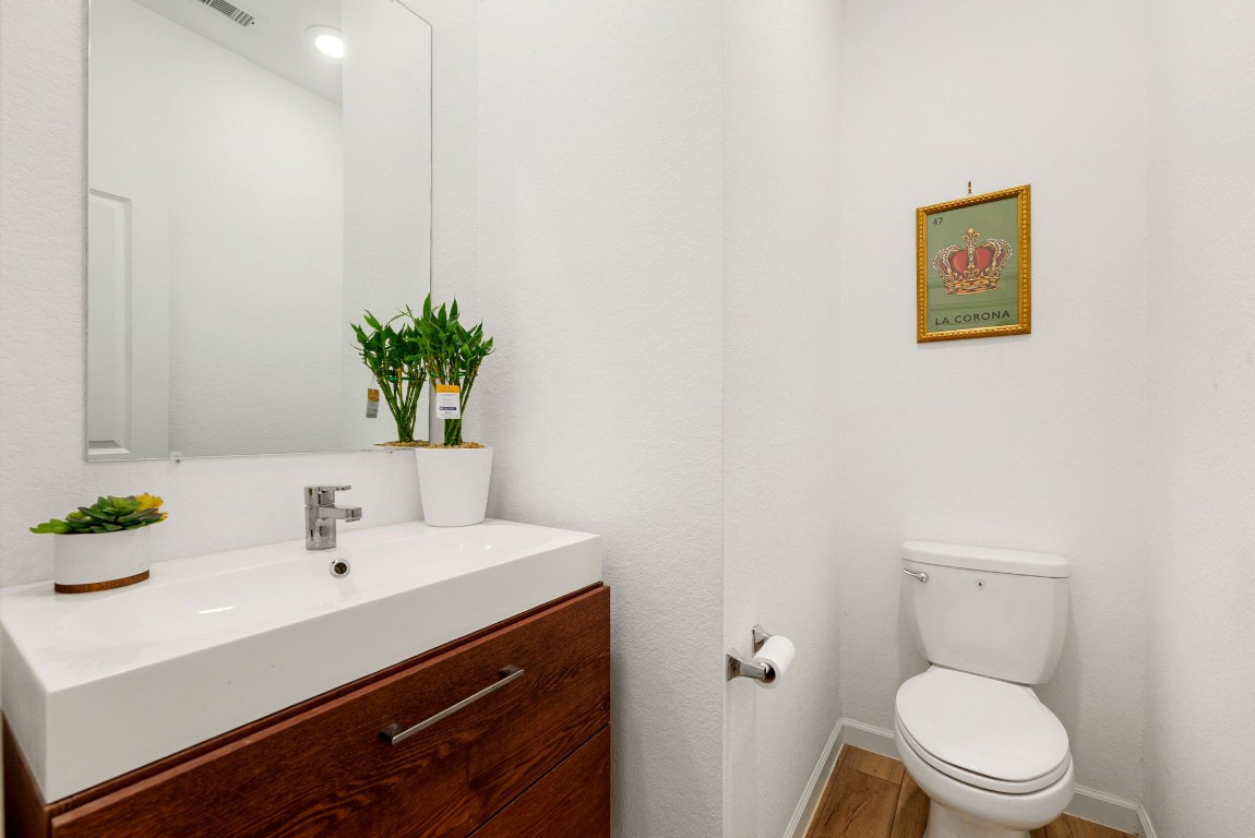 15500 Leopard Lily Lane Conroe, TX 77302 - Photo 17 of 50 a bathroom with a sink mirror and toilet