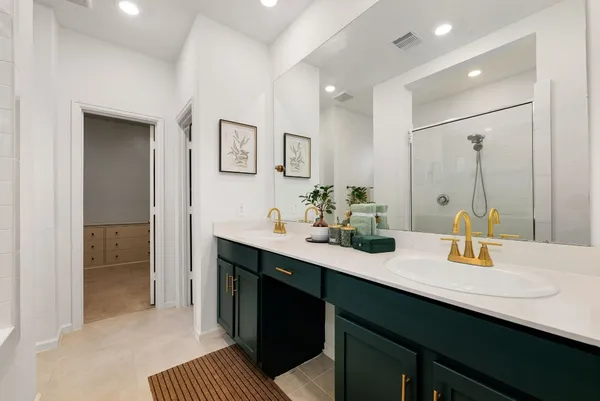 a bathroom with a sink double vanity and a mirror