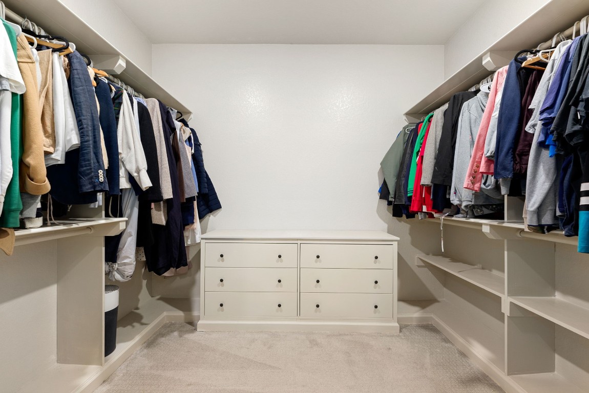 15500 Leopard Lily Lane Conroe, TX 77302 - Photo 21 of 50 a view of walk in closet with clothes and shoes