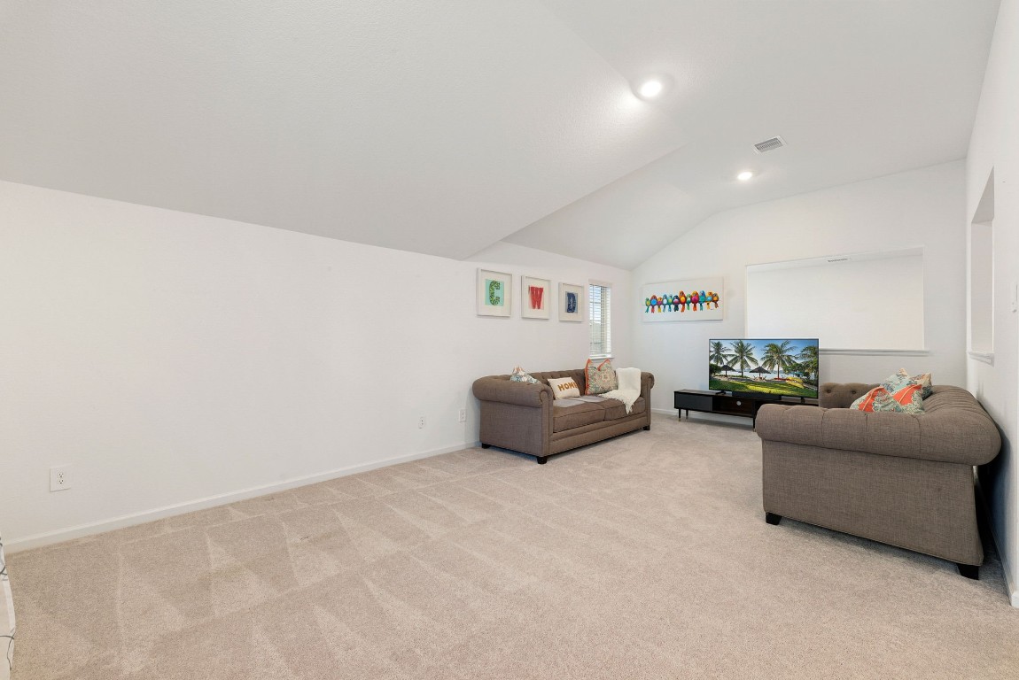 15500 Leopard Lily Lane Conroe, TX 77302 - Photo 23 of 50 a living room with furniture and a couch