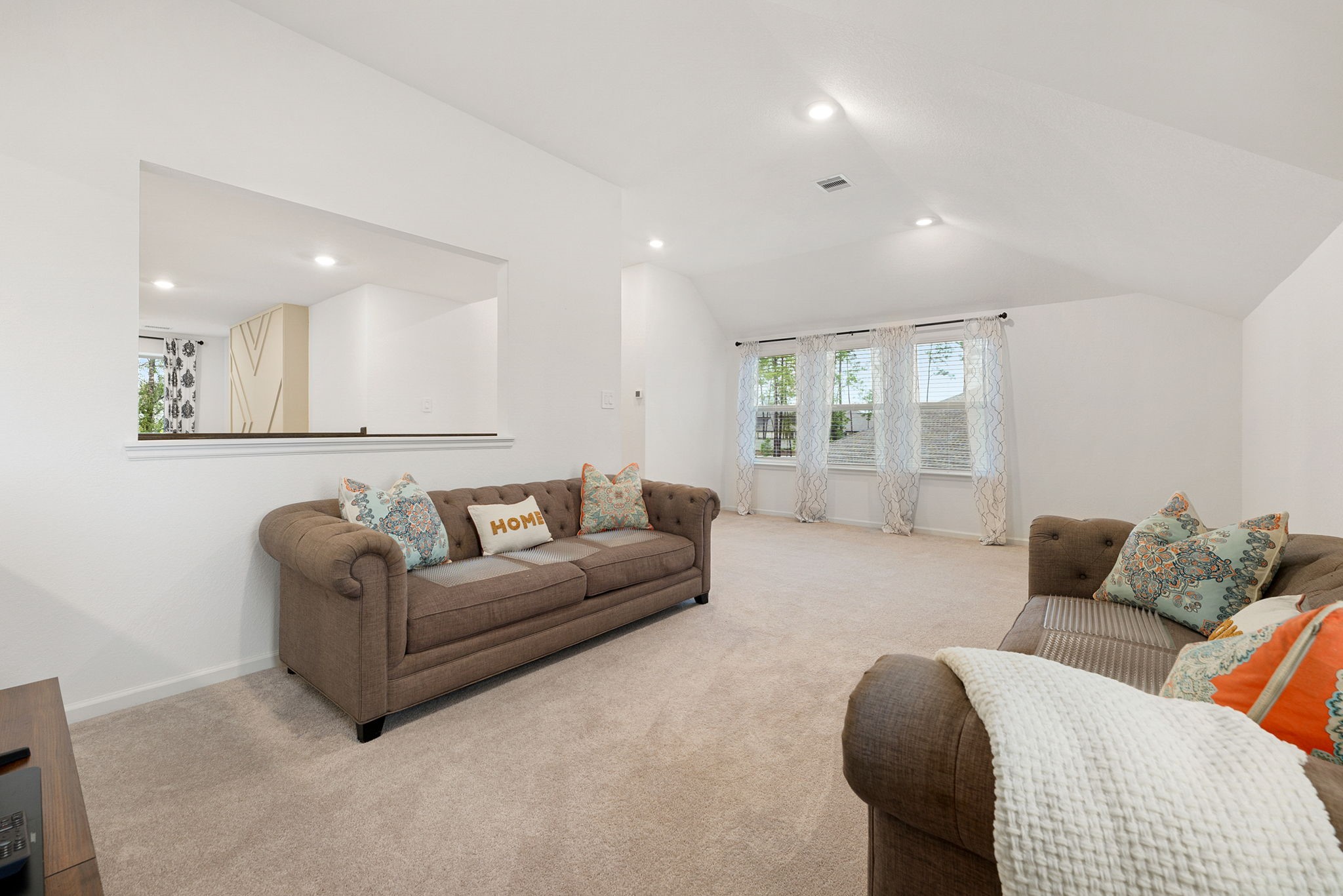15500 Leopard Lily Lane Conroe, TX 77302 - Photo 24 of 46 a living room with furniture and a large window