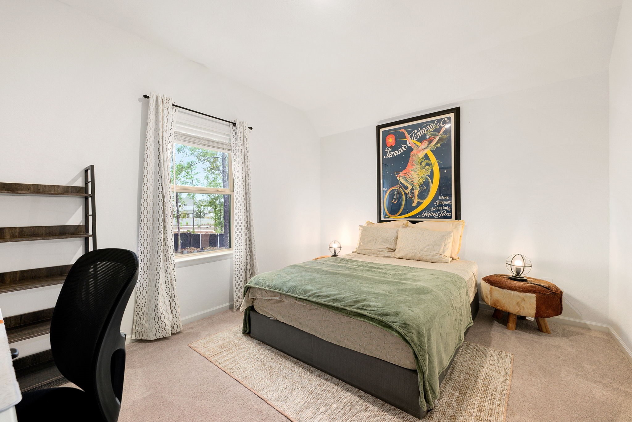 15500 Leopard Lily Lane Conroe, TX 77302 - Photo 26 of 46 a bedroom with a bed and a window