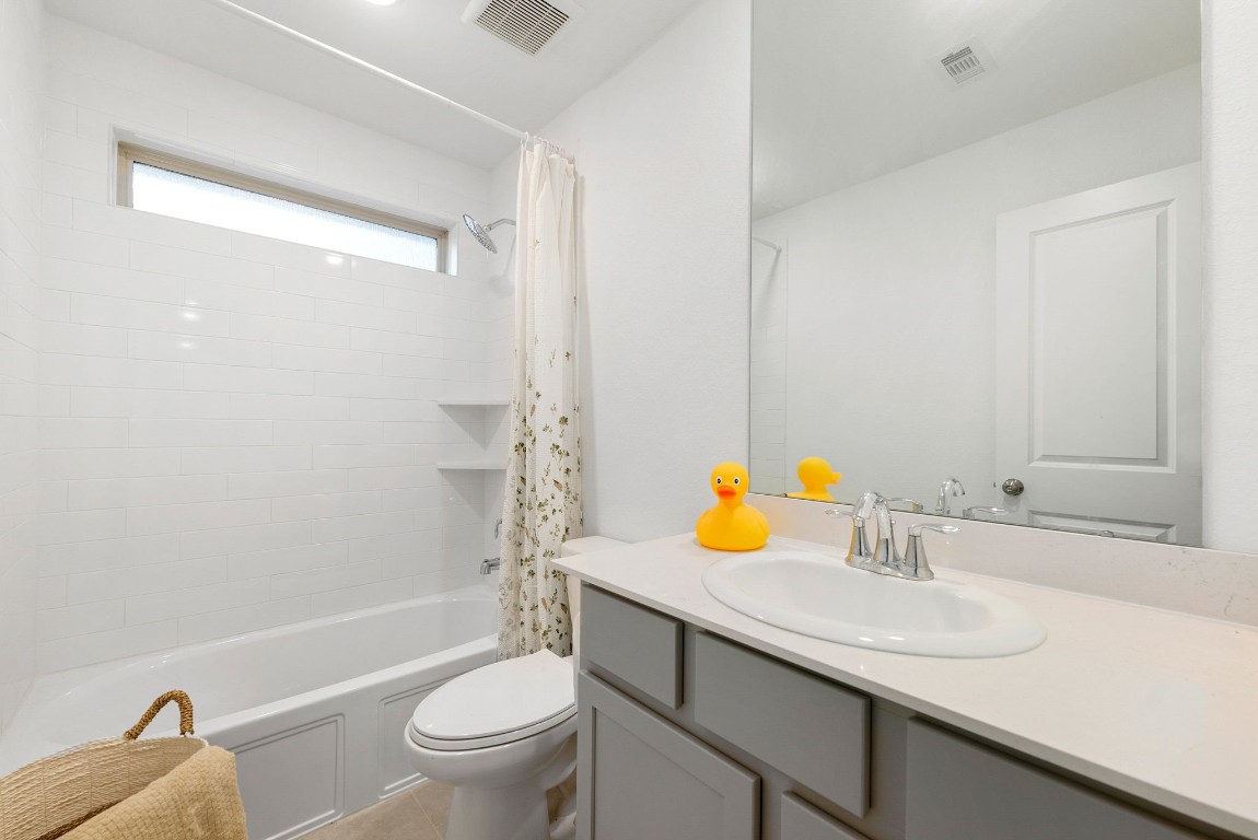 15500 Leopard Lily Lane Conroe, TX 77302 - Photo 32 of 50 a bathroom with a sink toilet and shower