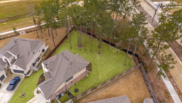 a view of a swimming pool with a yard