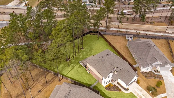 a view of a swimming pool with a yard and seating area