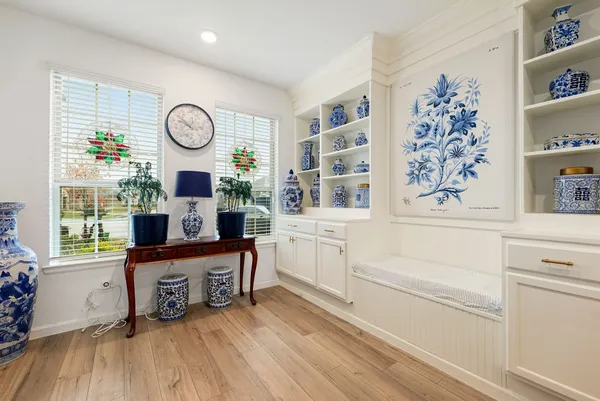 a living room with furniture and a window