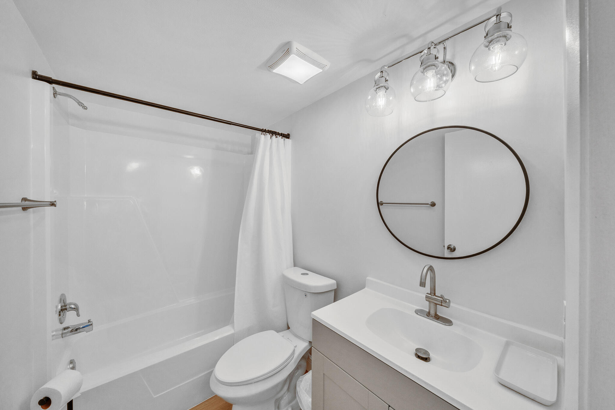22136 Palms Way, Unit 103 Boca Raton, FL 33433 - Photo 30 of 42 a bathroom with a sink a toilet and a mirror