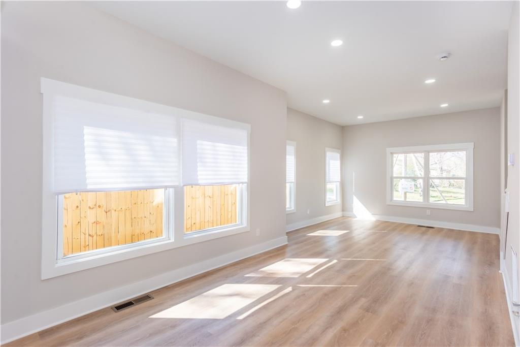 3286 Bachelor Street East Point, GA 30344 - Photo 26 of 45 a view of an empty room with wooden floor and a window