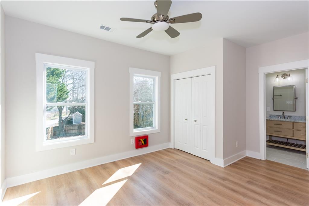3286 Bachelor Street East Point, GA 30344 - Photo 32 of 45 a view of an empty room with a window and wooden floor