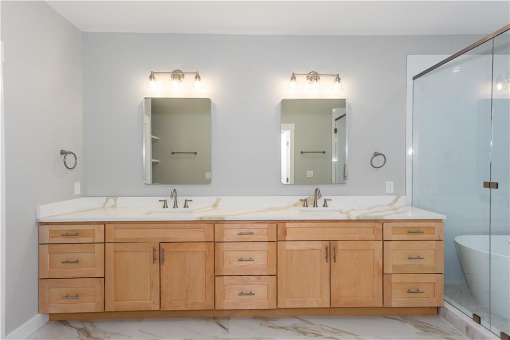 3286 Bachelor Street East Point, GA 30344 - Photo 38 of 45 a bathroom with a double vanity sink and mirror