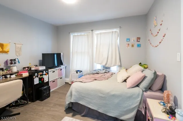 a bathroom with a sink vanity mirror and toilet