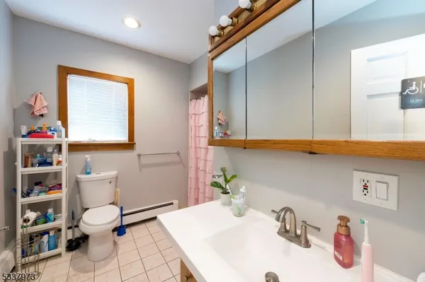 a kitchen that has a sink and chairs