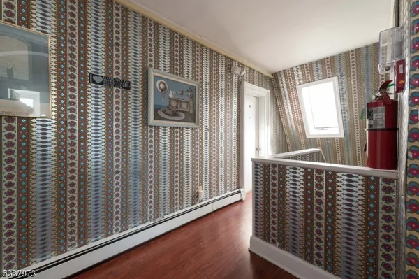 a bedroom with a bunk bed and a dresser in it