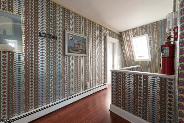 a bedroom with a bunk bed and a dresser in it