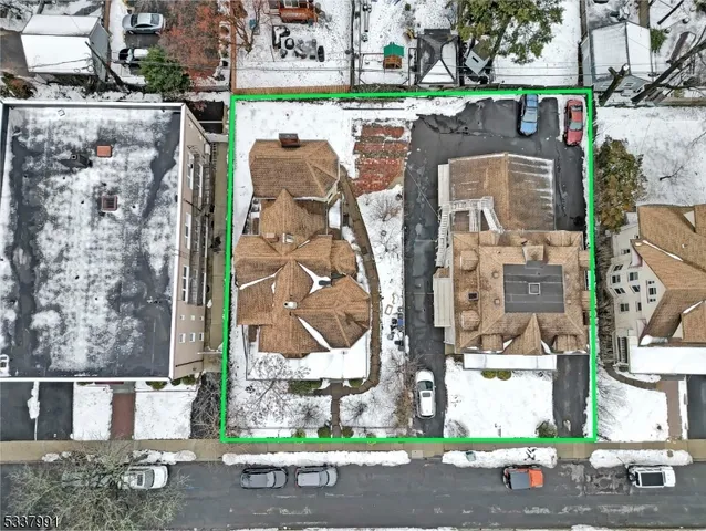 an aerial view of houses with outdoor space