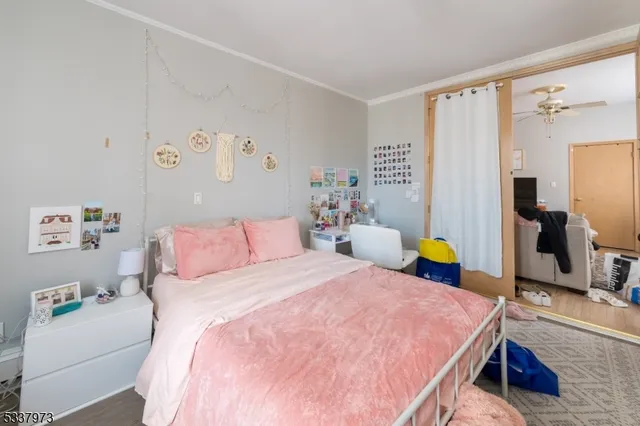 a bedroom with two beds and a couch