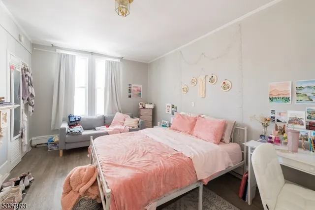 a bedroom with furniture and a bed